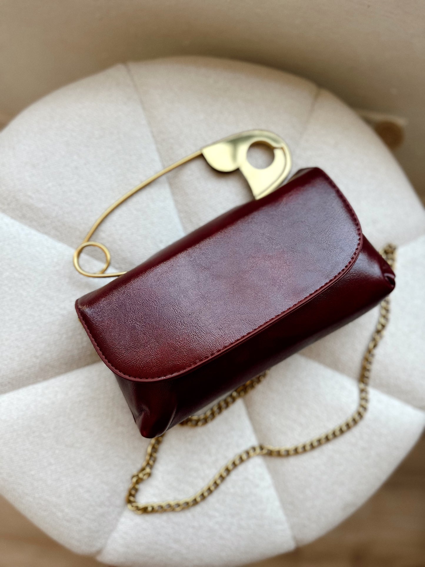 Safety pin burgundy crossbody bag