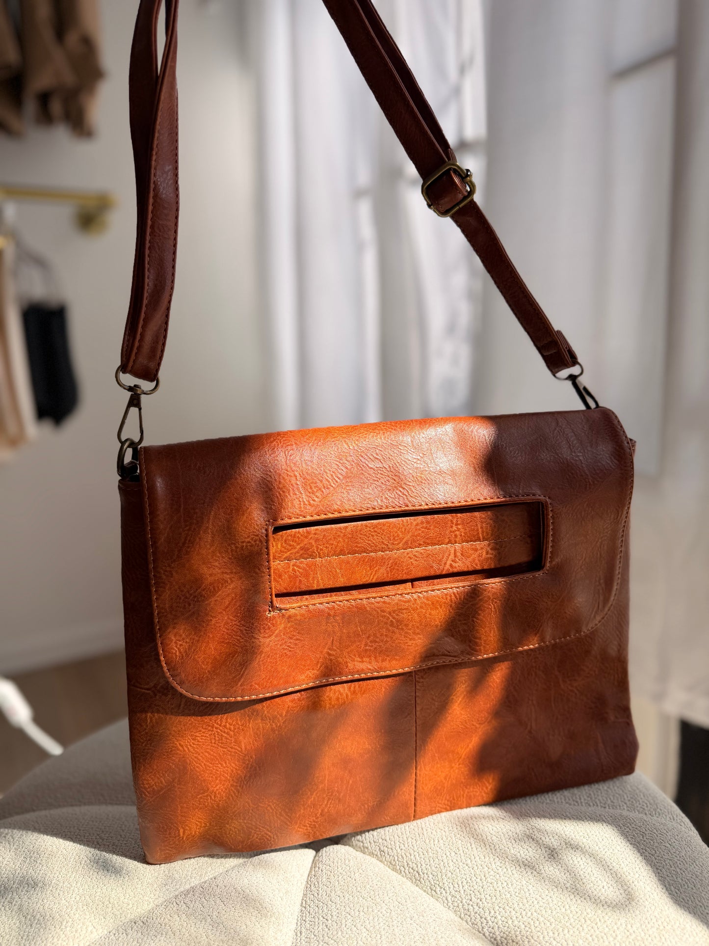 Brown leather clutch