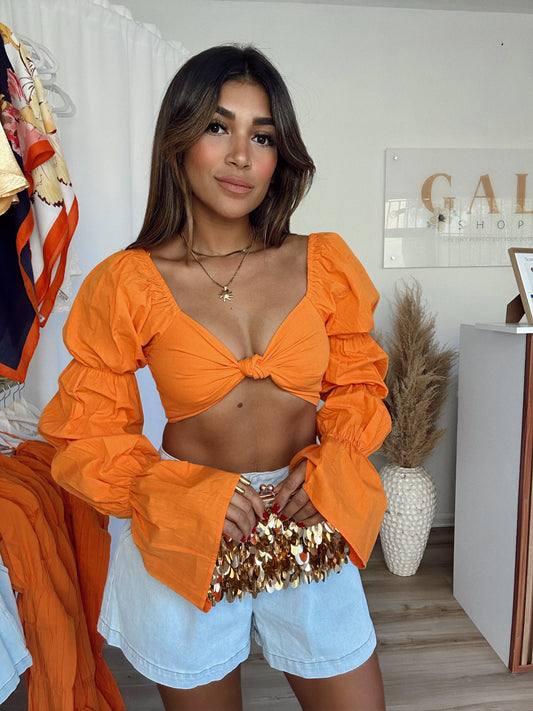 Bright orange top