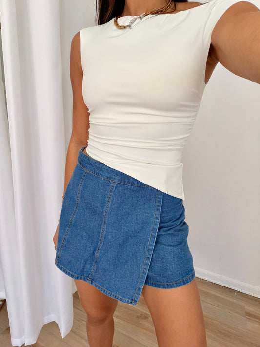 The asymmetrical denim skort