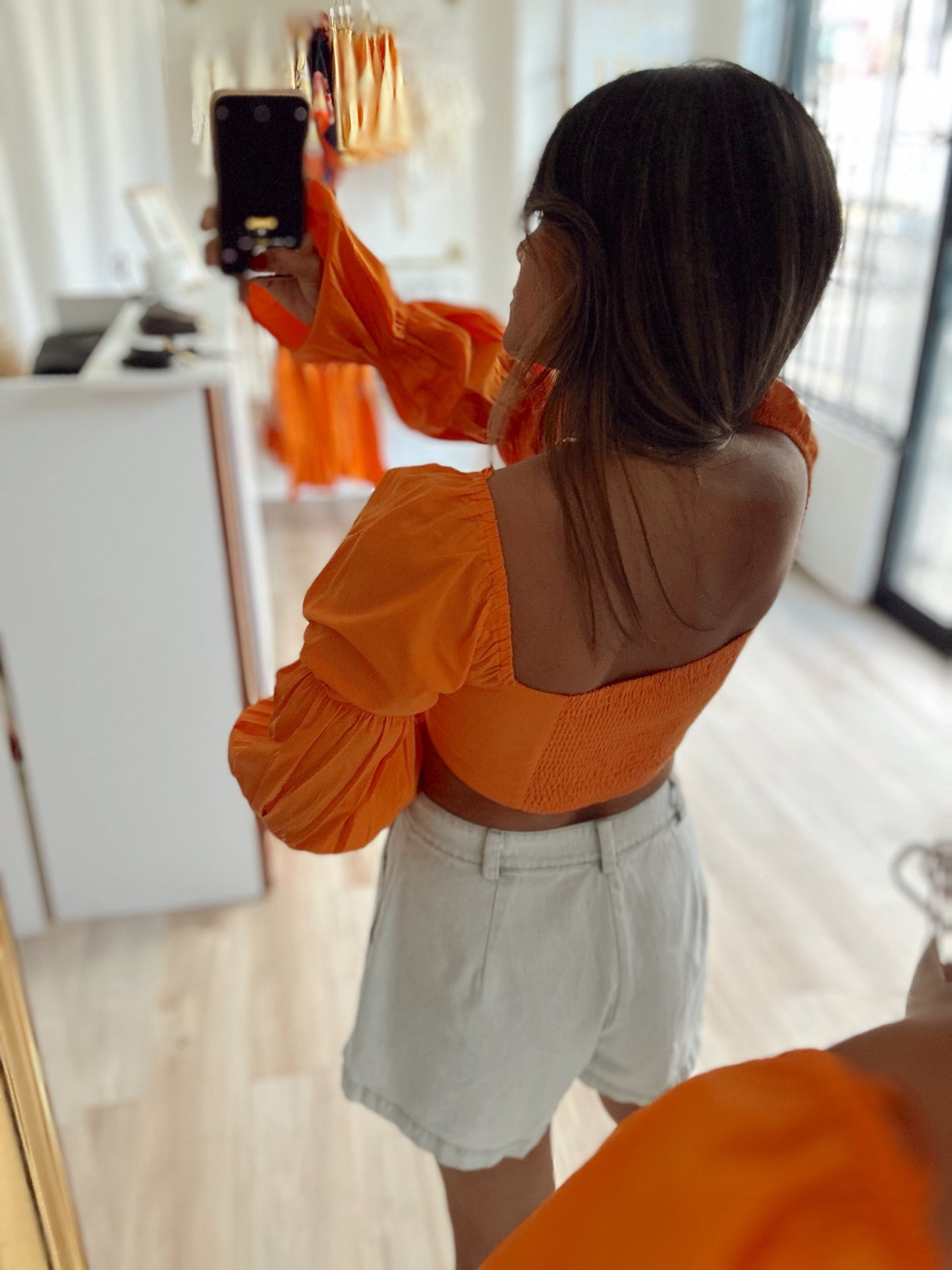 Bright orange top
