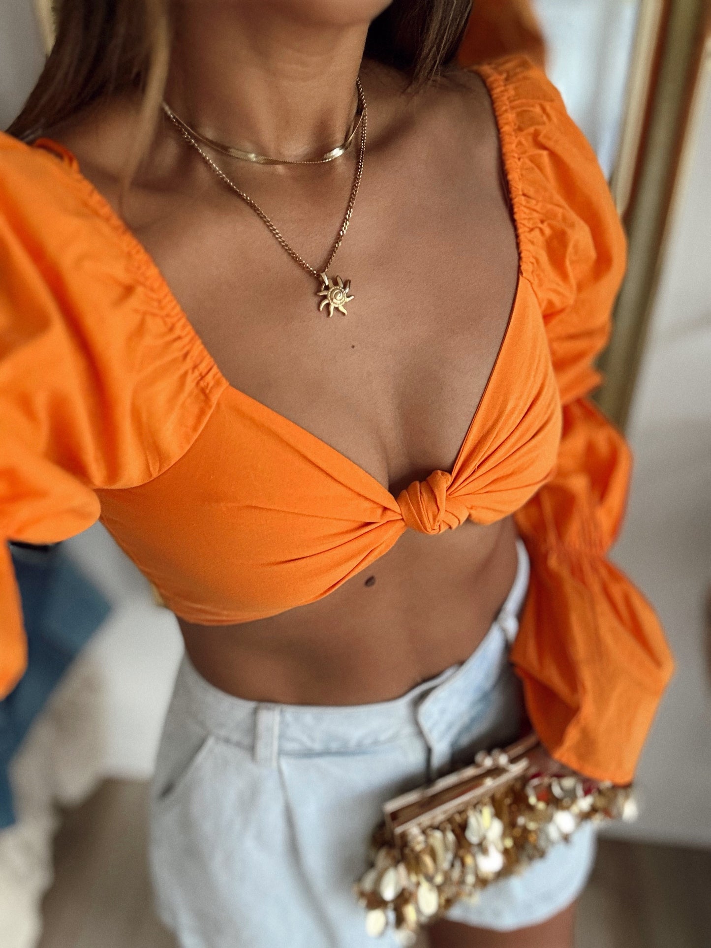 Bright orange top